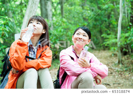 Mountaineering women mountain girl trekking mountain climbing outdoor hiking Mountaineering women mountain girl trekking mountain climbing outdoor hiking 65318874