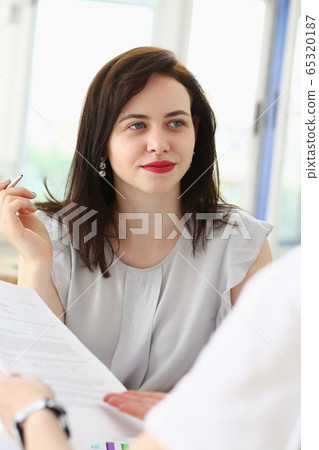 Beautiful woman portrait at workplace 65320187