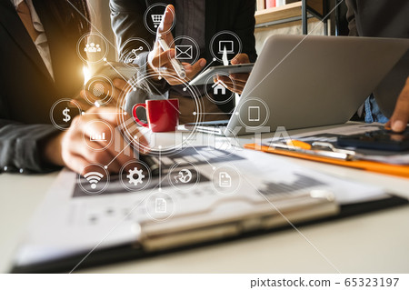 Business documents on office table with smart phone and calculator digital tablet and graph business with social network diagram and two colleagues discussing data working in the office Business documents on office table with smart phone and calculator digital tablet and graph business with social network diagram and two colleagues discussing data working in the office 65323197