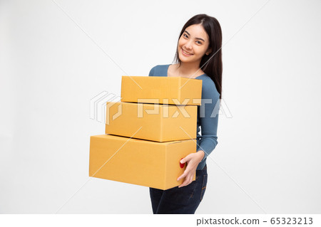 Happy Asian woman holding package parcel box, 65323213
