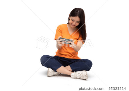 Young Asian woman wow expression and sitting on Young Asian woman wow expression and sitting on 65323214