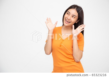 Portrait of excited screaming young asian woman 65323216