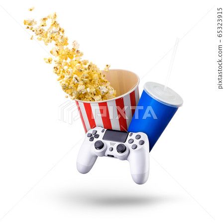 Paper bucket with popcorn, cup of drink and video game joystick on white Paper bucket with popcorn, cup of drink and video game joystick on white 65323915