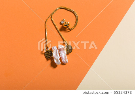 Top view of fashion jewelry and accessories on bright color background. Luxurious jewelry bijouterie and trendy concept. 65324378