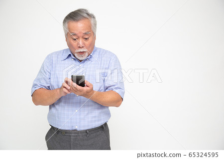 Asian senior man using smartphone and receiving 65324595