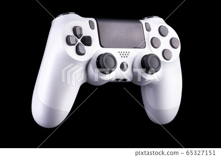 White video game joystick gamepad isolated on a black background White video game joystick gamepad isolated on a black background 65327151