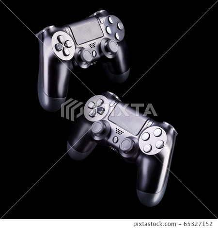 Set of black video game joysticks gamepad isolated on a black background 65327152