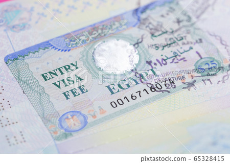 Egyptian visa in a passport closeup. Macro. Egyptian visa in a passport closeup. Macro. 65328415
