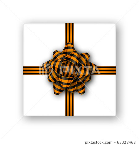 Gift box with a black and orange tied bow and copy space Gift box with a black and orange tied bow and copy space 65328468
