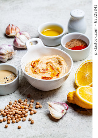Hummus bowl and ingredients for making hummus. 65328843