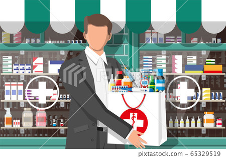 Man holding drugstore bag in front of pharmacy 65329519