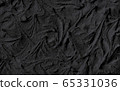 Natural texture liquid cosmetic activated charcoal or volcanic clay for face mask and body. Trendy nursing black wood background. 65331036