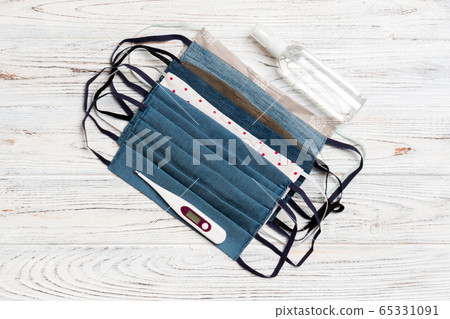 Top view of handmade cotton masks, alcohol hand Top view of handmade cotton masks, alcohol hand 65331091