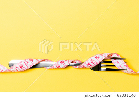 Composition of curled wrapped measuring tape and Composition of curled wrapped measuring tape and 65331146