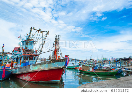 The fishing boat moored in the river access to the sea. The fishing boat moored in the river access to the sea. 65331372