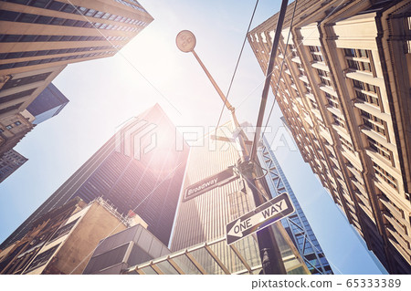 Looking up at New York buildings against the sun. Looking up at New York buildings against the sun. 65333389