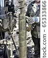 Drilling machine for drilling holes in the ground 65333866