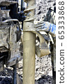 Drilling machine for drilling holes in the ground 65333868