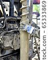 Drilling machine for drilling holes in the ground 65333869