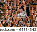 Aerial top down drone view on Piran town with narrow streets, ancient buildings with red roofs and Piazza 1. Maggio in southwestern Slovenia 65334342