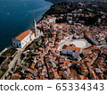 Aerial view on Piran town with Tartini main square, ancient buildings with red roofs, St. George's Parish Church and Adriatic sea in southwestern Slovenia 65334343