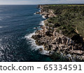 Areal view Island scenery, seascape Spain Majorca, beach bay Cala s'Almunia, beautiful coastline Mediterranean Sea. Balearic Islands, Cliff of Cala S'Almunia in Santanyi 65334591