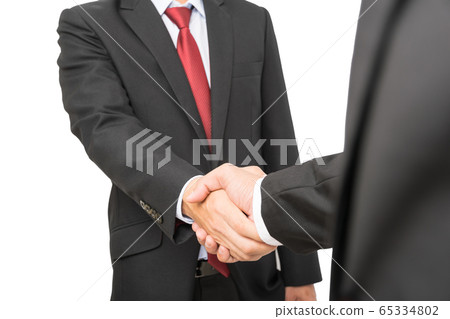 Businessman shake hands after success agreement discussion 65334802