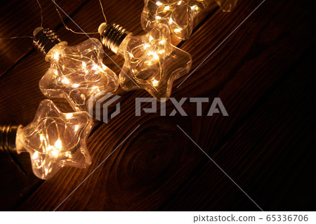 Bright luminous Christmas garlands in the shape of 65336706