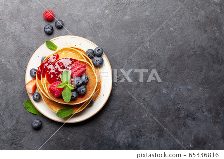 Delicious homemade pancakes with summer berries Delicious homemade pancakes with summer berries 65336816