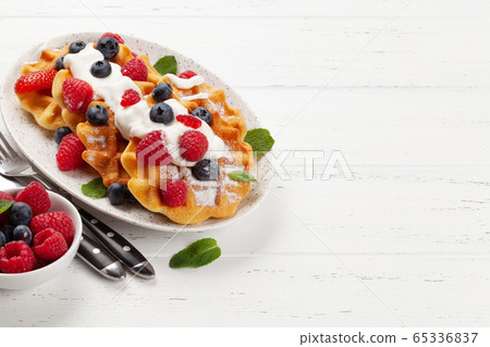 Delicious belgian waffles with summer berries 65336837