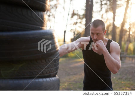 Man fighter training boxing outdoor fitness Man fighter training boxing outdoor fitness 65337354