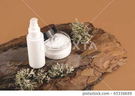 Cream for the face on the bark of a tree. Natural care concept. 65338689