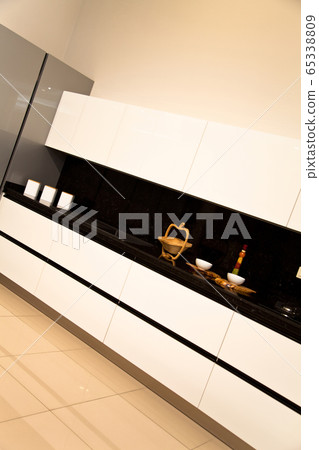 Interior of luxurious modern kitchen white grey Interior of luxurious modern kitchen white grey 65338809