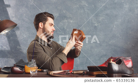 young attractive male designer working in his Studio young attractive male designer working in his Studio 65339136