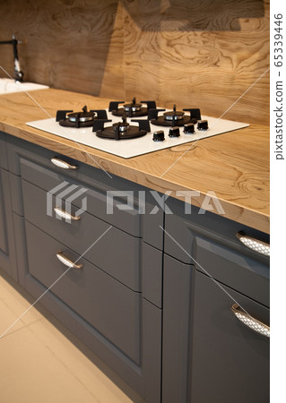Interior of luxurious wooden modern kitchen grey Interior of luxurious wooden modern kitchen grey 65339446