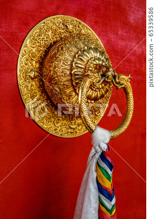 Lion shaped door handle in Buddhist temple 65339586