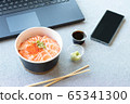 New normal and work from home concept. Salmon Sushi rice box takeaway meal lunch at office. eating during busy hour with laptop and mobile phone by food delivery service 65341300
