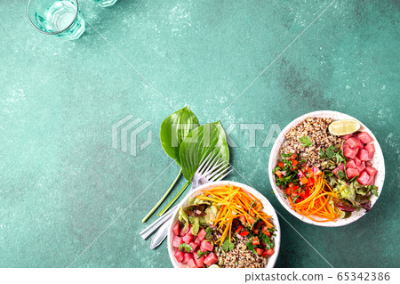 Vercion of Hawaiian tuna poke bowl with quinoa. 65342386