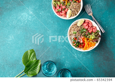 Vercion of Hawaiian tuna poke bowl with quinoa. 65342394