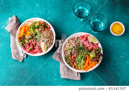 Vercion of Hawaiian tuna poke bowl with quinoa. 65342397