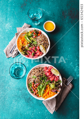 Vercion of Hawaiian tuna poke bowl with quinoa. 65342403