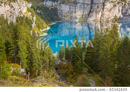 Panorama of Oeschinensee lake and Alps, Switzerland. Panorama of Oeschinensee lake and Alps, Switzerland. 65342839