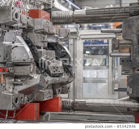 metal press for plastic castings for the automotive industry in the factory. Industry 4.0 65342936