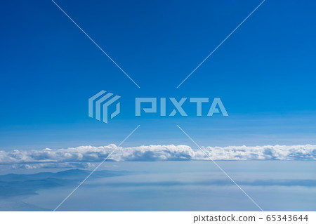 Clouds, Mountain range and coastline with blue sky background Clouds, Mountain range and coastline with blue sky background 65343644