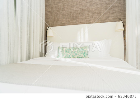 White comfortable pillow on bed decoration interior White comfortable pillow on bed decoration interior 65346873