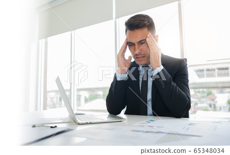 Frustrated stressed businessman feeling tired  65348034