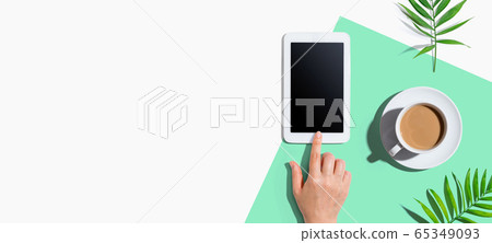 Person using a tablet computer 65349093