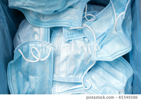 Separating infected waste. Wastes increased due to coronavirus pandemic. Quarantine is over background. Facemask utilization. Usage of one-use face mask. Separating Separating infected waste. Wastes increased due to coronavirus pandemic. Quarantine is over background. Facemask utilization. Usage of one-use face mask. Separating 65349386