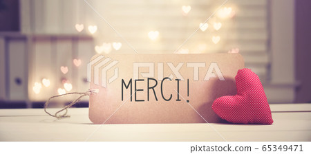 Merci - Thank you in French language with a red heart Merci - Thank you in French language with a red heart 65349471