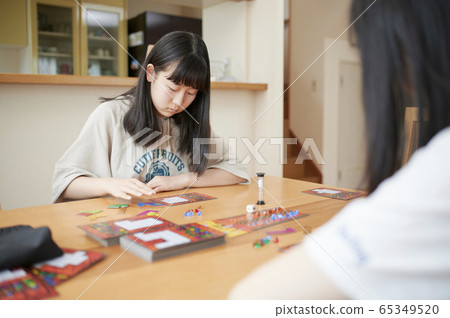 Family playing board games 65349520